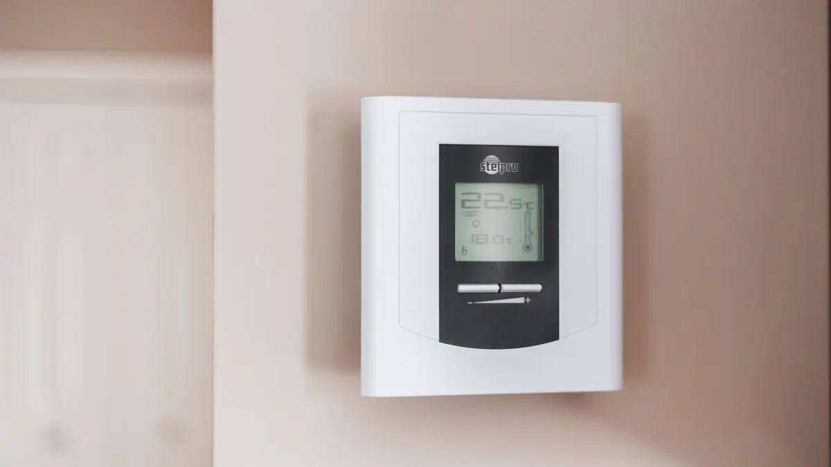 White Thermostat Hanging on the Wall
