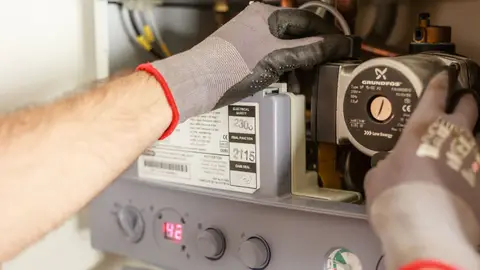 Plumber Repairing Power Source