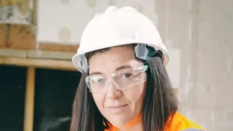 Handywoman Holding a Plumbers Wrench (2)