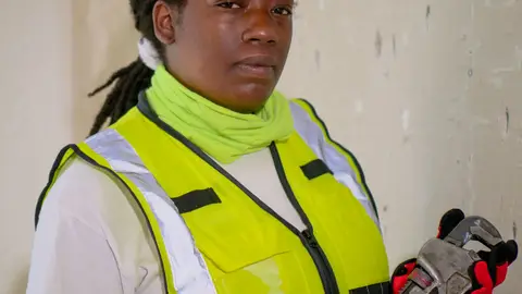 Handywoman Holding a Plumbers Wrench