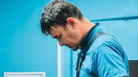 Male Technician Working in Workshop Setting