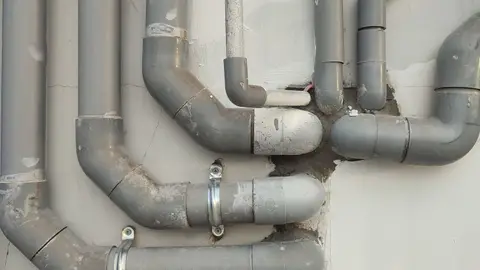 Plastic Pipes on Wall