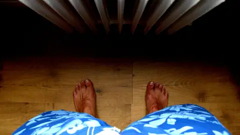 First Person View of a Person Standing by the Radiator