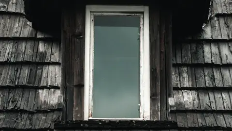 Close-up of a Roof Dormer Window in an Old House
