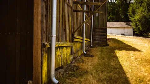 Rain Gutters on Wall of Wooden Barn