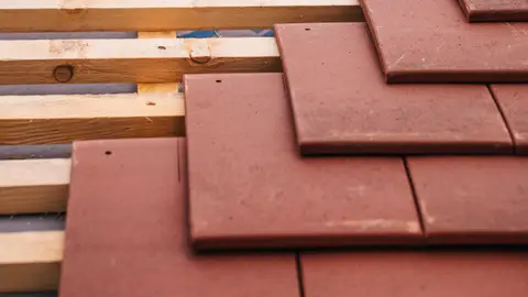 Roof Construction with Red Tiles and Wooden Framework