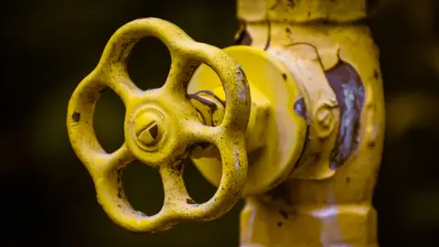 Close Up Photo of a Yellow Shut Off Valve