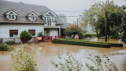 Flooded Suburban House During Heavy Rain